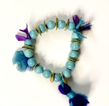 Load and play video in Gallery viewer, Handmade Bohemian Turquoise and Gold Beaded Bracelet with Purple/Indigo Tassels - #0053
